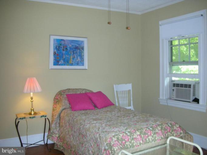 635 Deepdene Road Baltimore, MD 21210 - Photo 8 of 11 a bedroom with a bed and a window