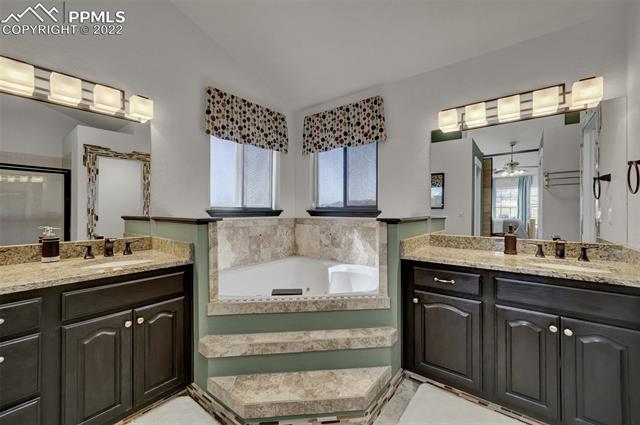 755 Struthers Loop Colorado Springs, CO 80921 - Photo 15 of 37 Master bathroom with 2 vanities, jet tub, shower