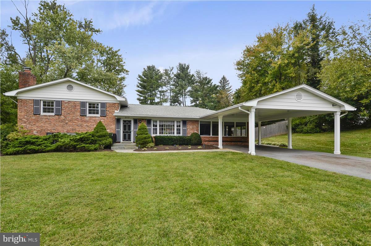 2117 Apple Tree Lane Silver Spring, MD 20905 - Photo 1 of 30 a front view of a house with a garden