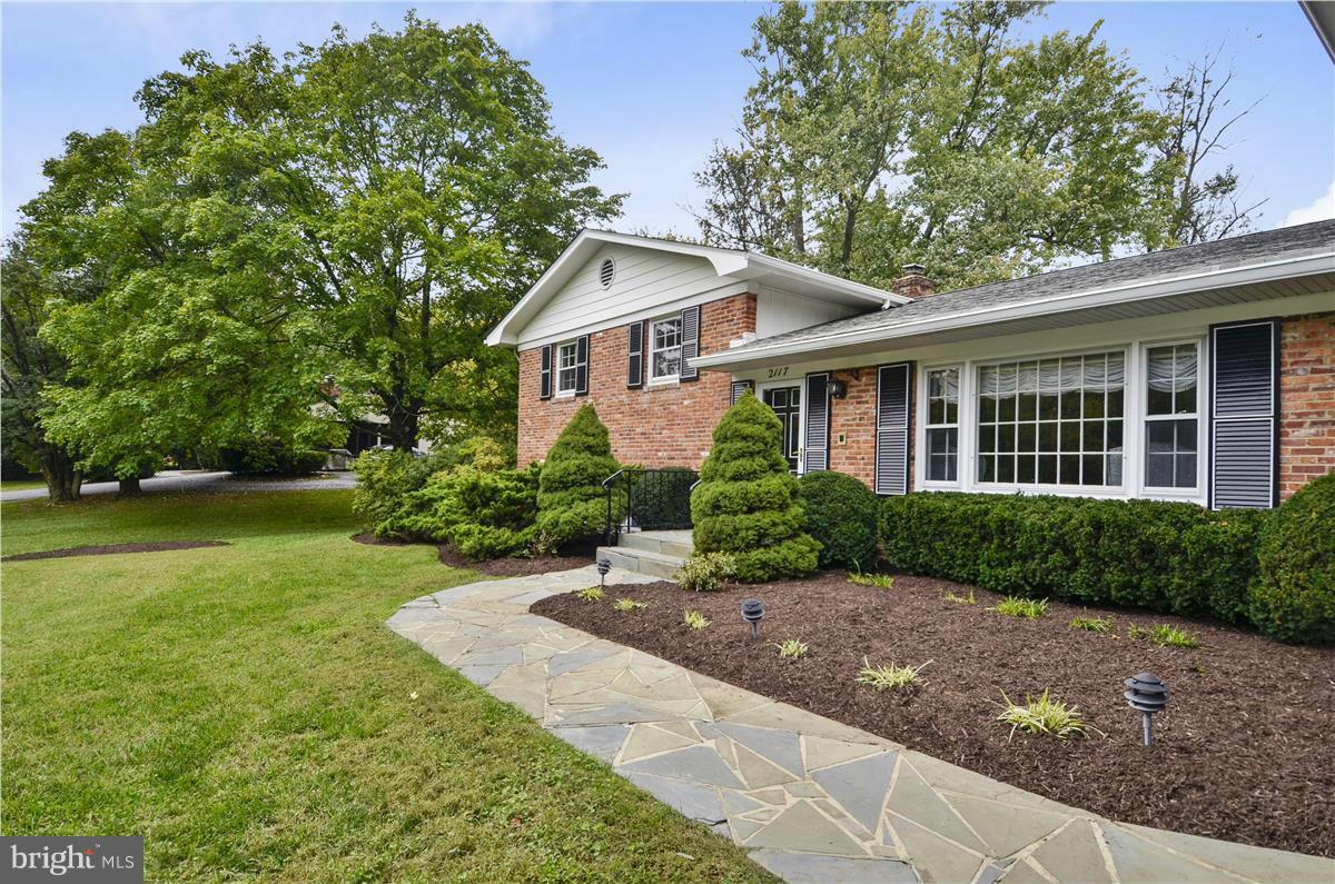 2117 Apple Tree Lane Silver Spring, MD 20905 - Photo 2 of 30 a front view of a house with a garden