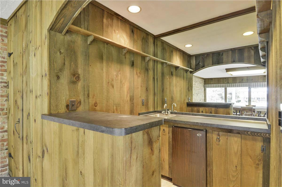 2117 Apple Tree Lane Silver Spring, MD 20905 - Photo 13 of 30 a bathroom with a sink and a mirror