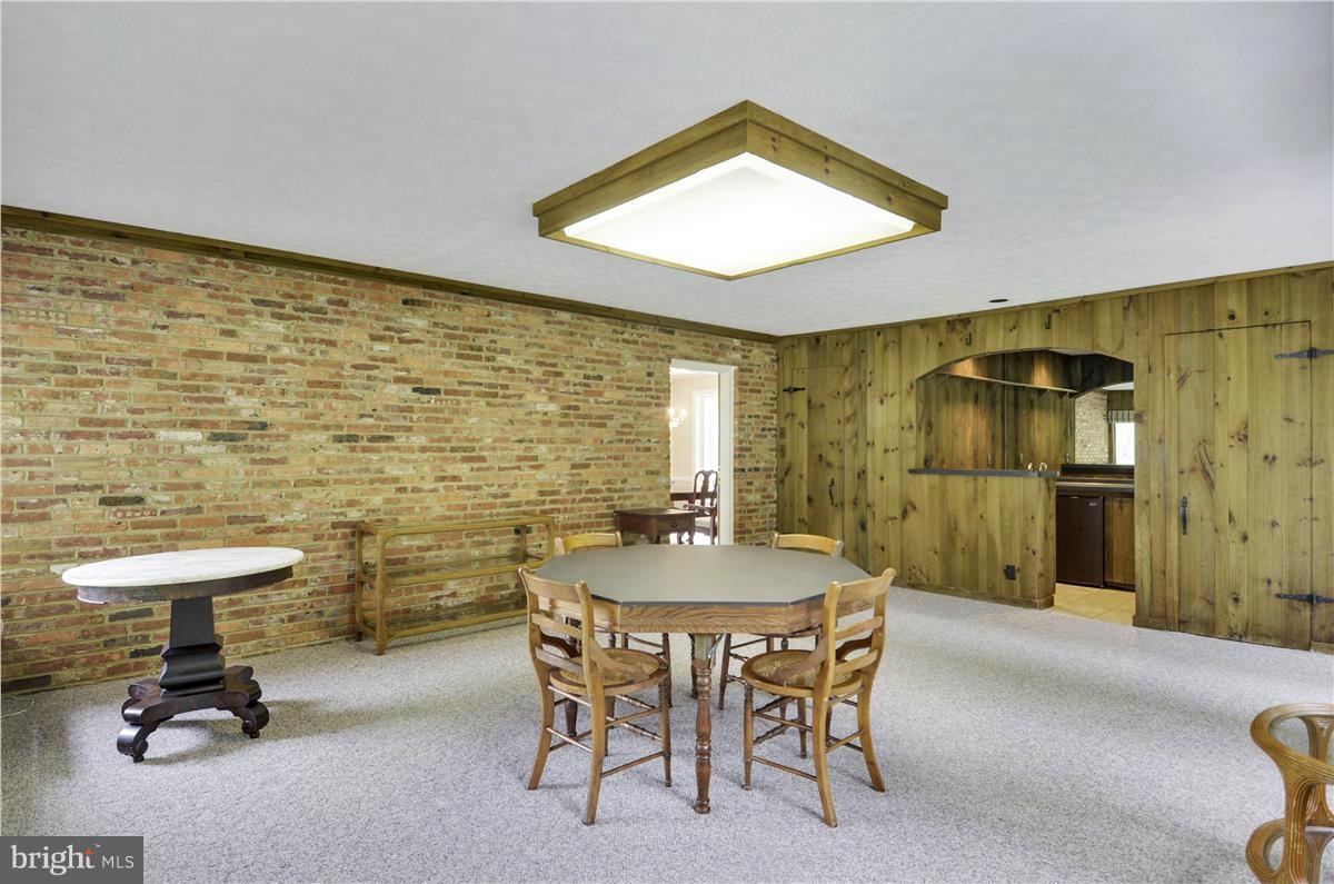 2117 Apple Tree Lane Silver Spring, MD 20905 - Photo 15 of 30 a dining room with furniture and a floor to ceiling window