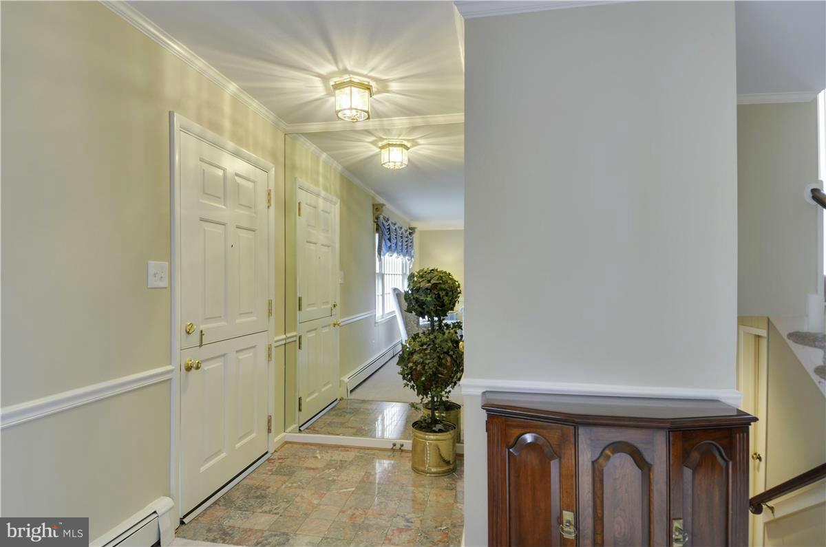 2117 Apple Tree Lane Silver Spring, MD 20905 - Photo 3 of 30 a view of a hallway with chandelier