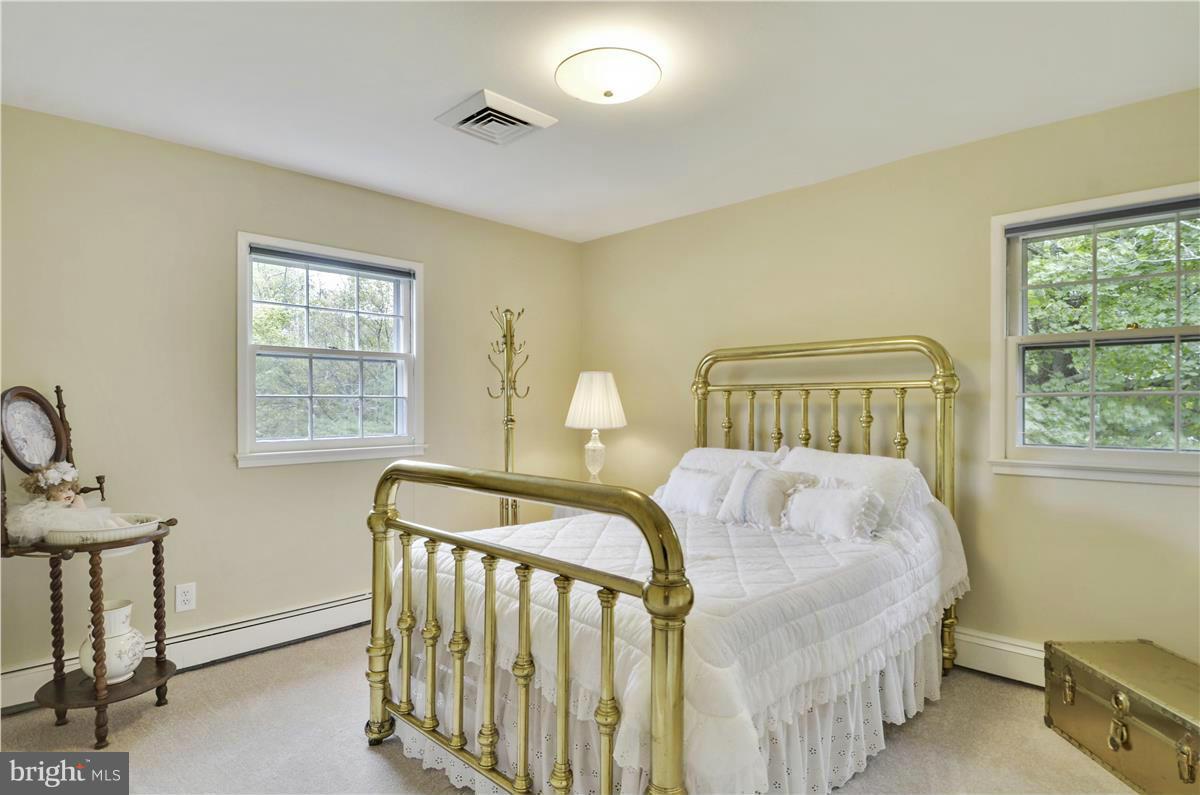 2117 Apple Tree Lane Silver Spring, MD 20905 - Photo 22 of 30 a bedroom with a bed and a window