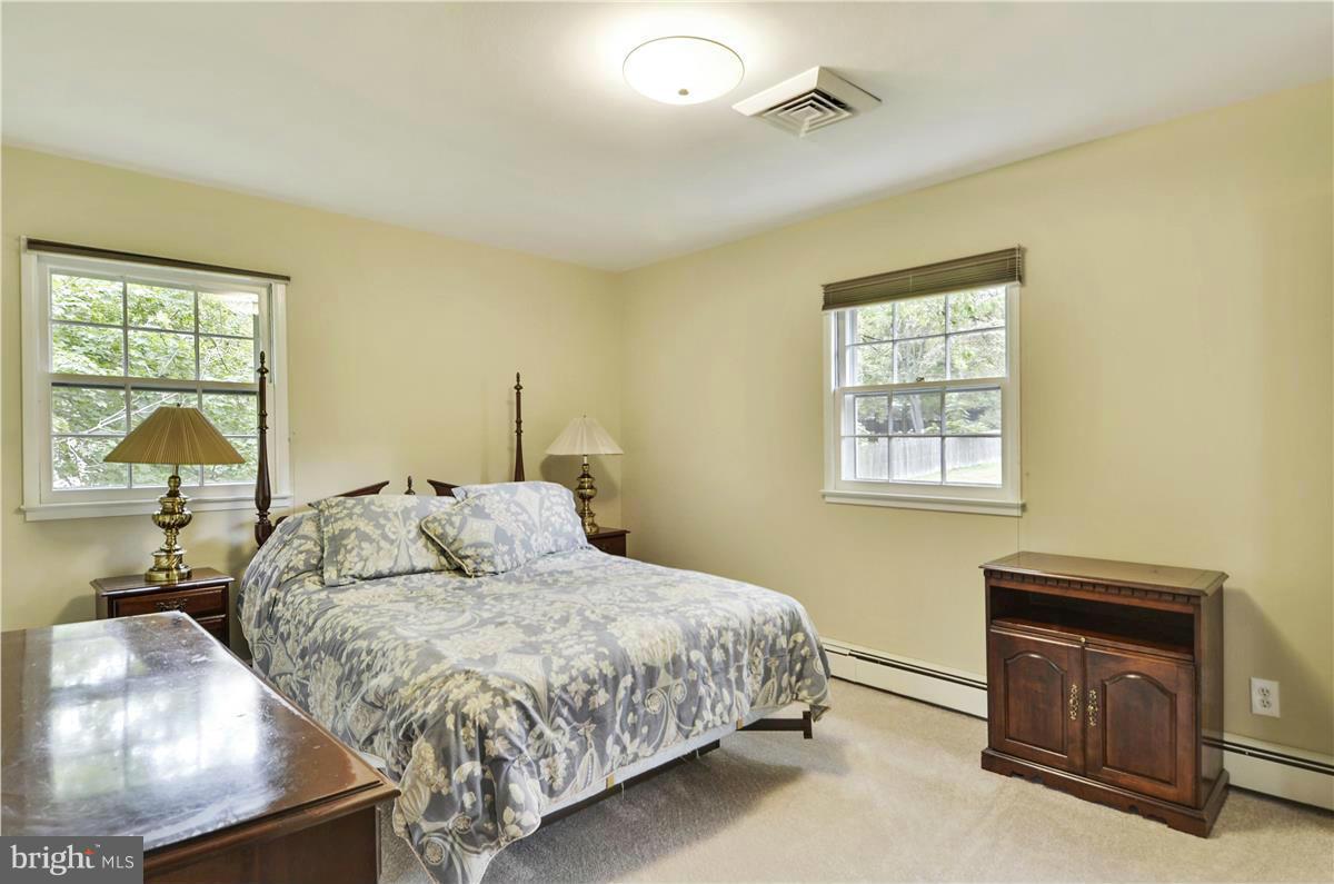 2117 Apple Tree Lane Silver Spring, MD 20905 - Photo 23 of 30 a bedroom with a bed and a window
