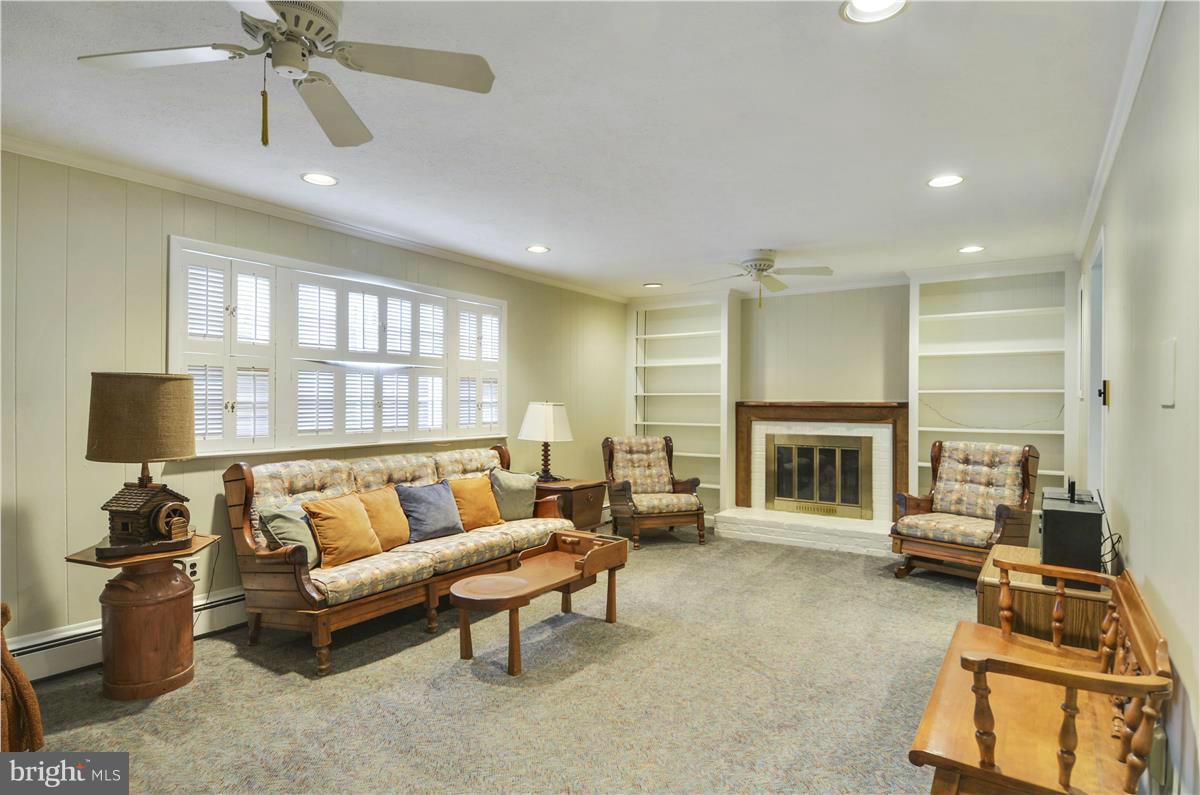 2117 Apple Tree Lane Silver Spring, MD 20905 - Photo 25 of 30 a living room with furniture and a fireplace