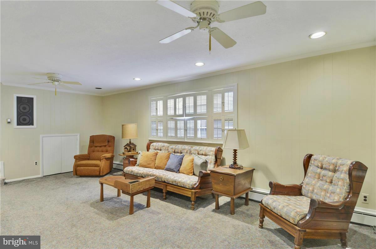 2117 Apple Tree Lane Silver Spring, MD 20905 - Photo 26 of 30 a living room with furniture and a chandelier