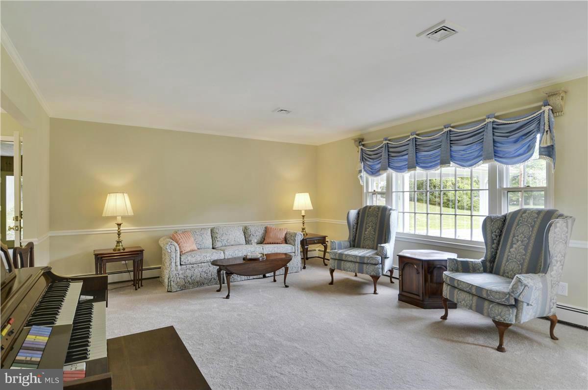 2117 Apple Tree Lane Silver Spring, MD 20905 - Photo 4 of 30 a living room with furniture and a large window