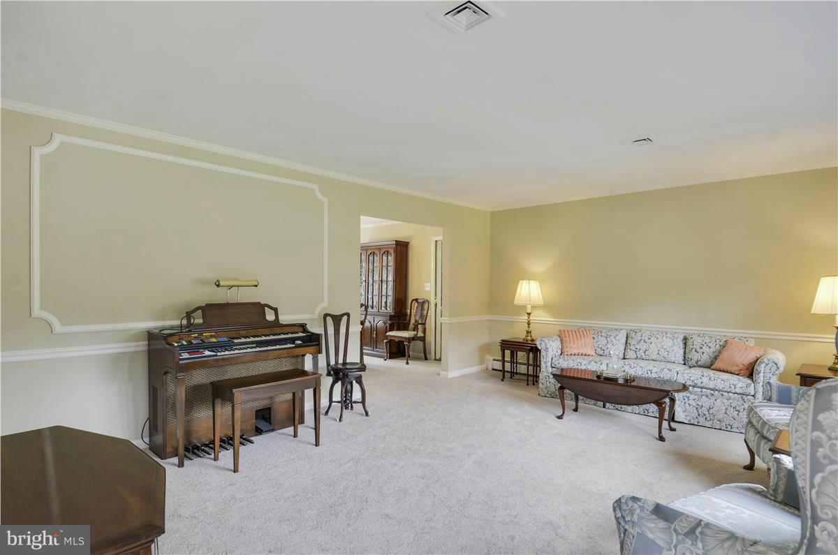 2117 Apple Tree Lane Silver Spring, MD 20905 - Photo 5 of 30 a living room with furniture and a piano