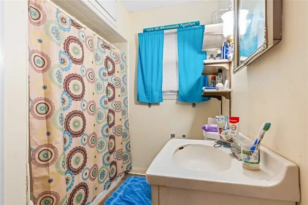 a bedroom with a bed and a cabinet