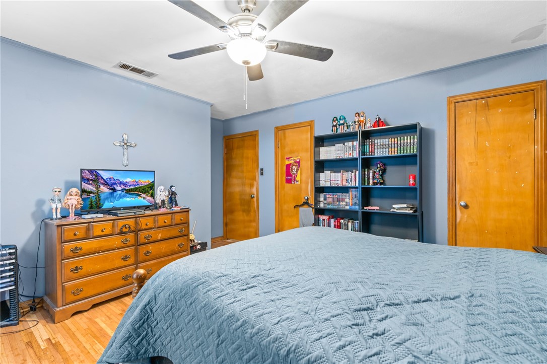 200 East Brenda Avenue Waco, TX 76705 - Photo 17 of 23 a bedroom with a bed and a cabinet