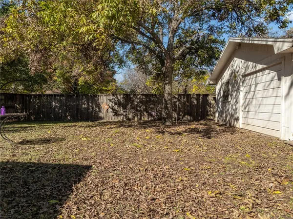 a view of a backyard of the house