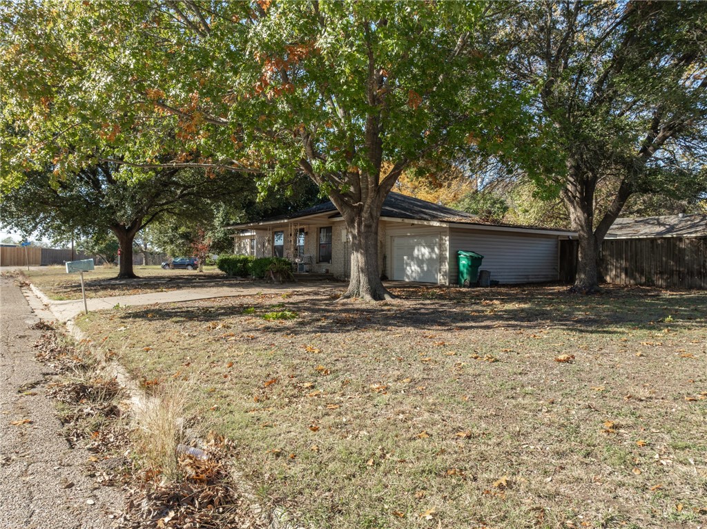 200 East Brenda Avenue Waco, TX 76705 - Photo 23 of 23 a front view of a house with a yard and garage