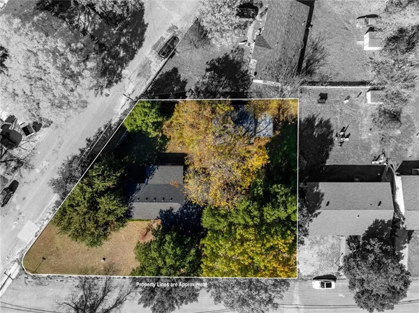 an aerial view of a residential houses with outdoor space