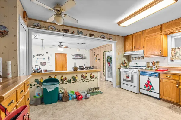 a kitchen with refrigerator and cabinets