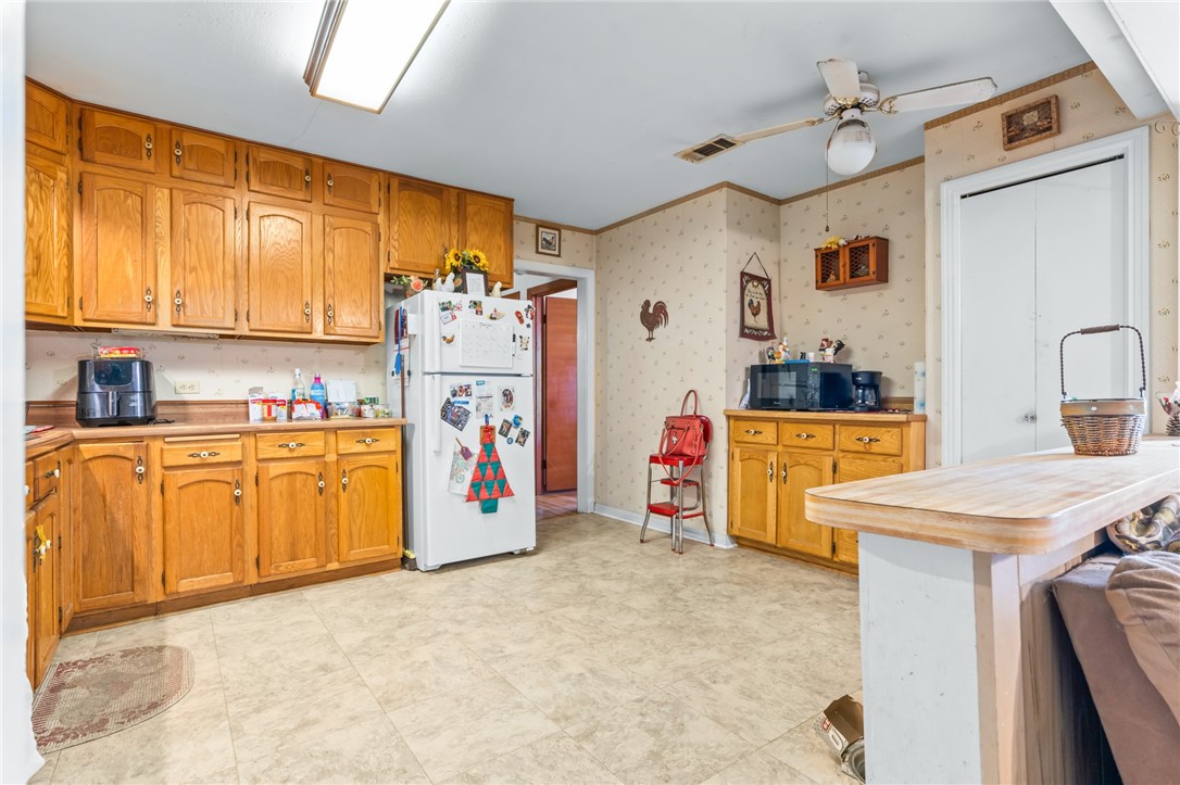 200 East Brenda Avenue Waco, TX 76705 - Photo 10 of 23 a view of kitchen with refrigerator and microwave