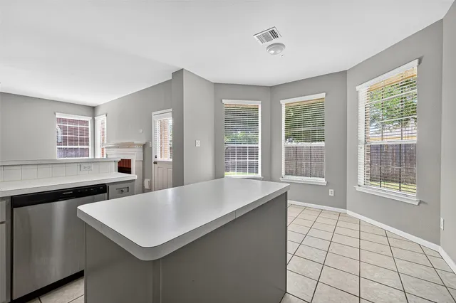 a kitchen with a stove and a refrigerator