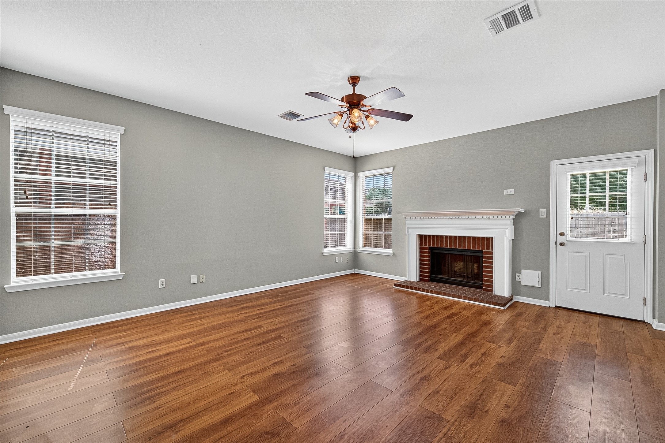 7411 Pacific Ridge Court Houston, TX 77095 - Photo 21 of 50 a view of empty room with wooden floor and fireplace
