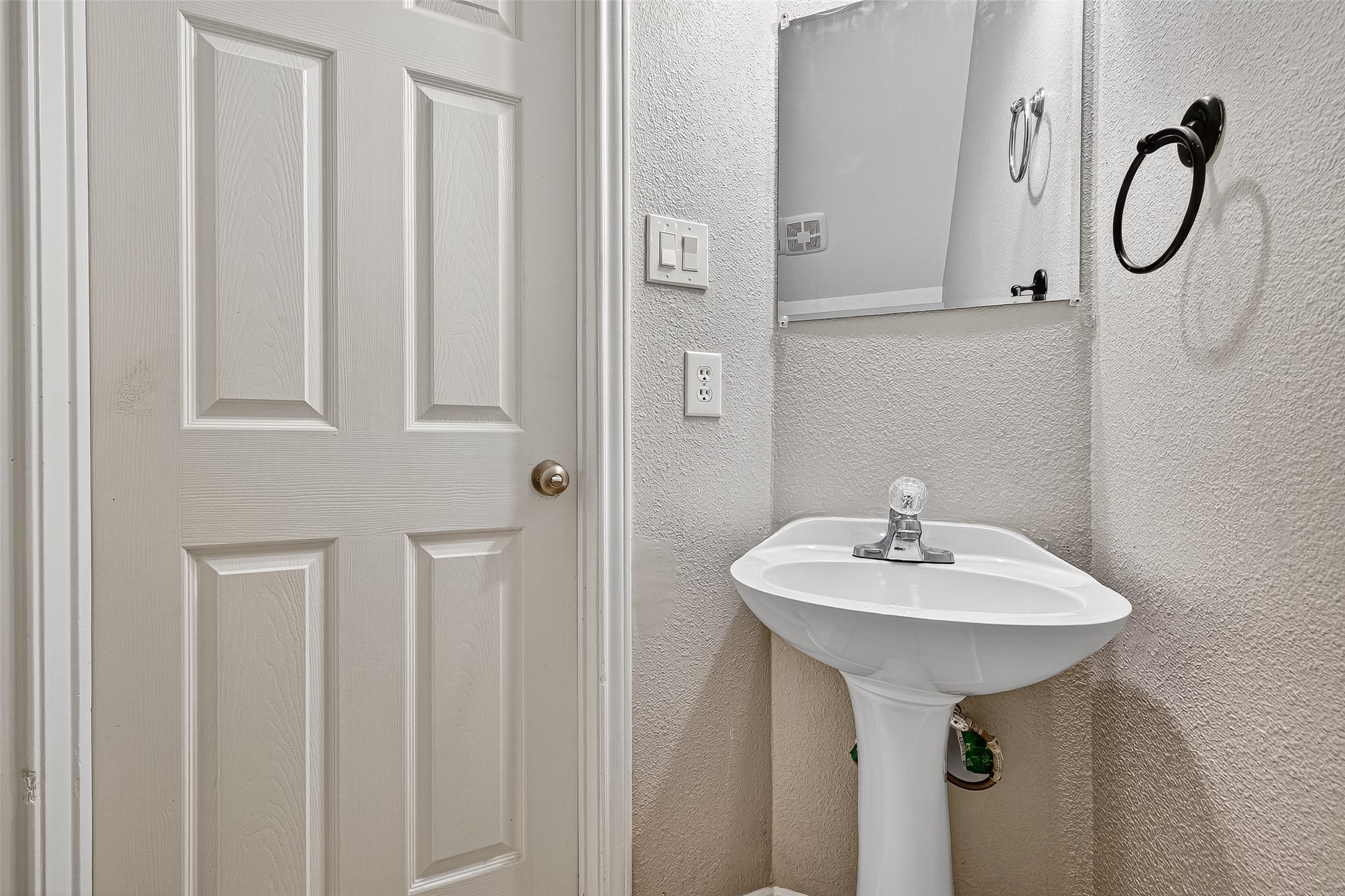7411 Pacific Ridge Court Houston, TX 77095 - Photo 23 of 50 a bathroom with a sink a mirror and a shower
