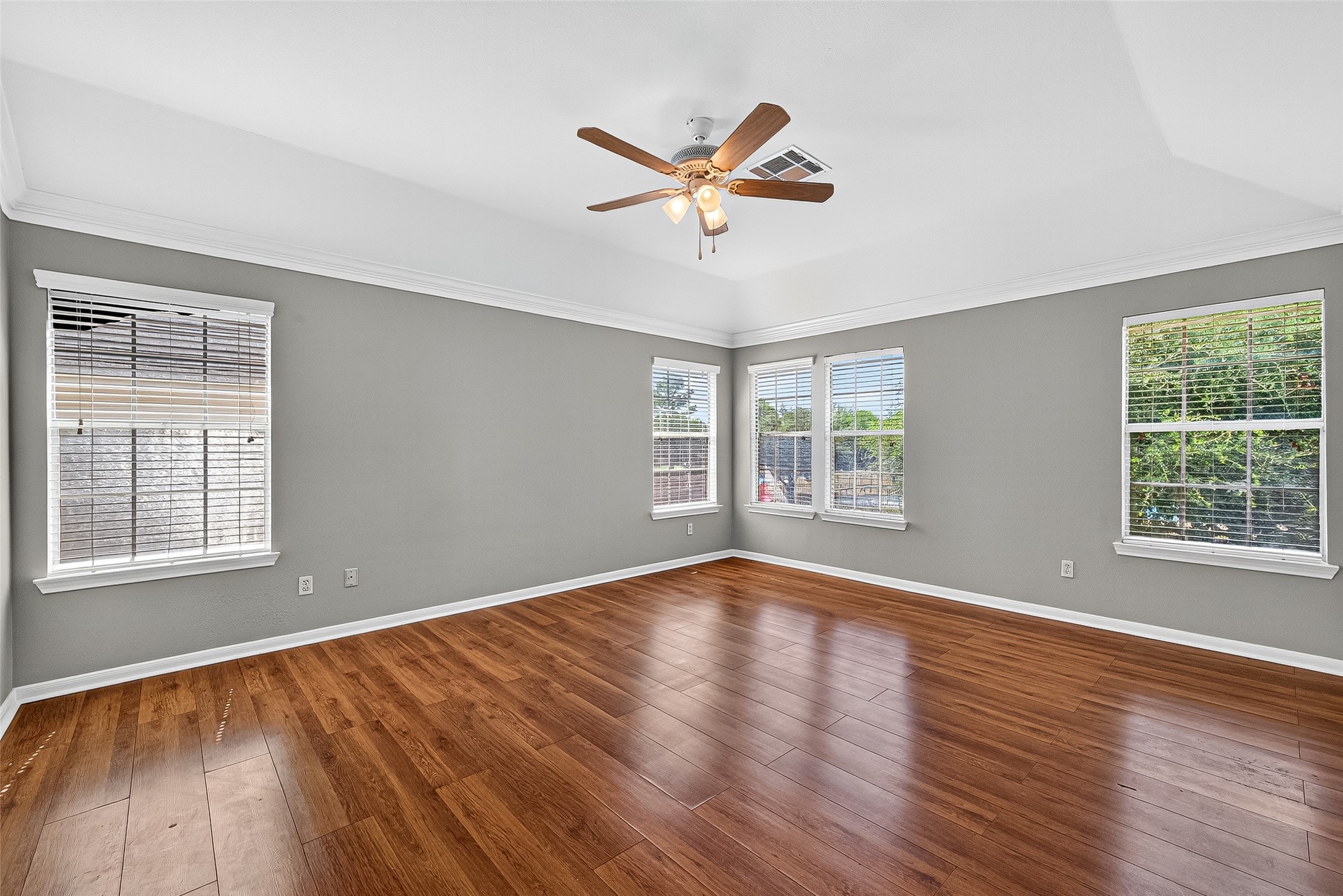 7411 Pacific Ridge Court Houston, TX 77095 - Photo 27 of 50 a view of empty room with wooden floor and fan