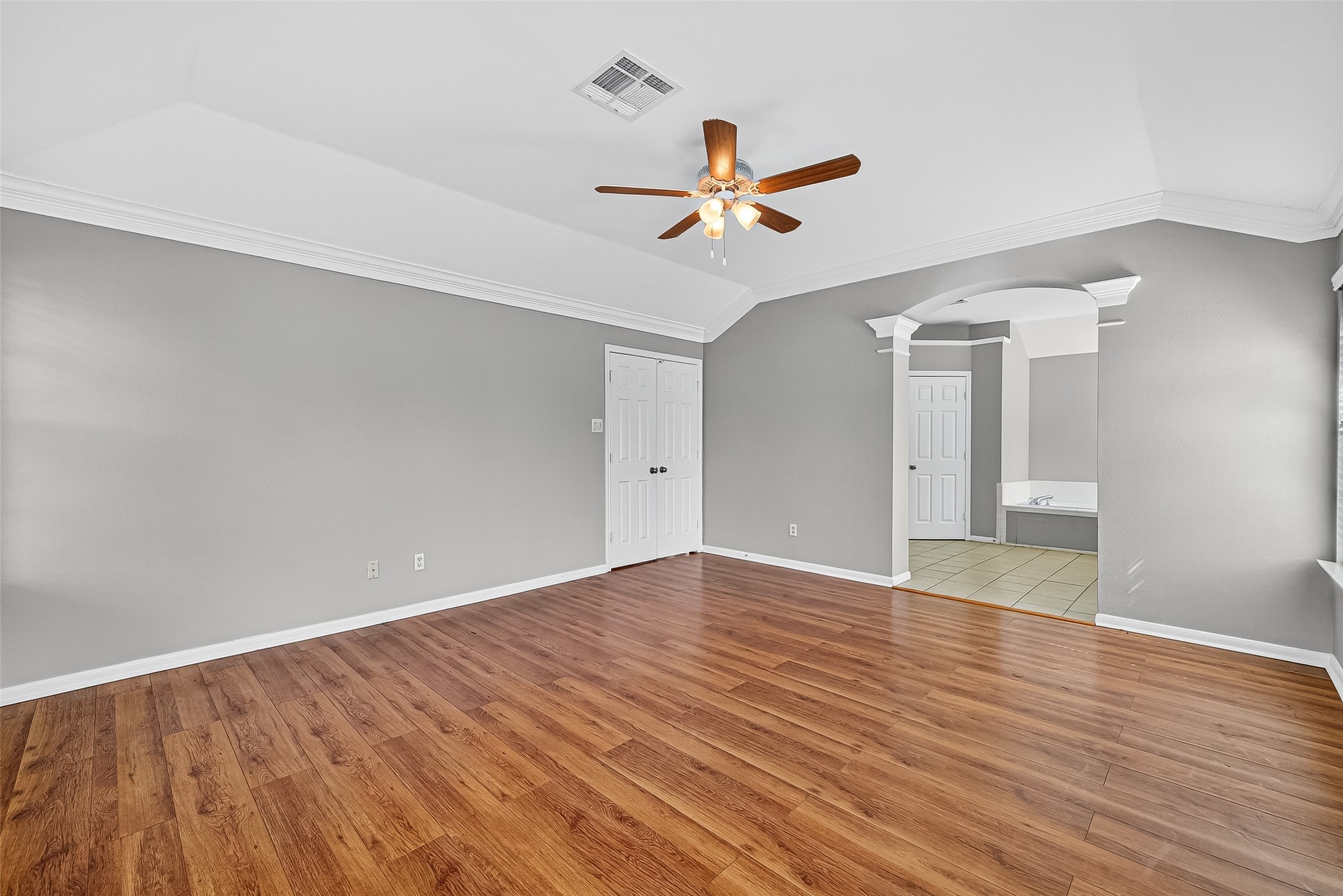 7411 Pacific Ridge Court Houston, TX 77095 - Photo 29 of 50 a view of empty room with wooden floor and ceiling fan