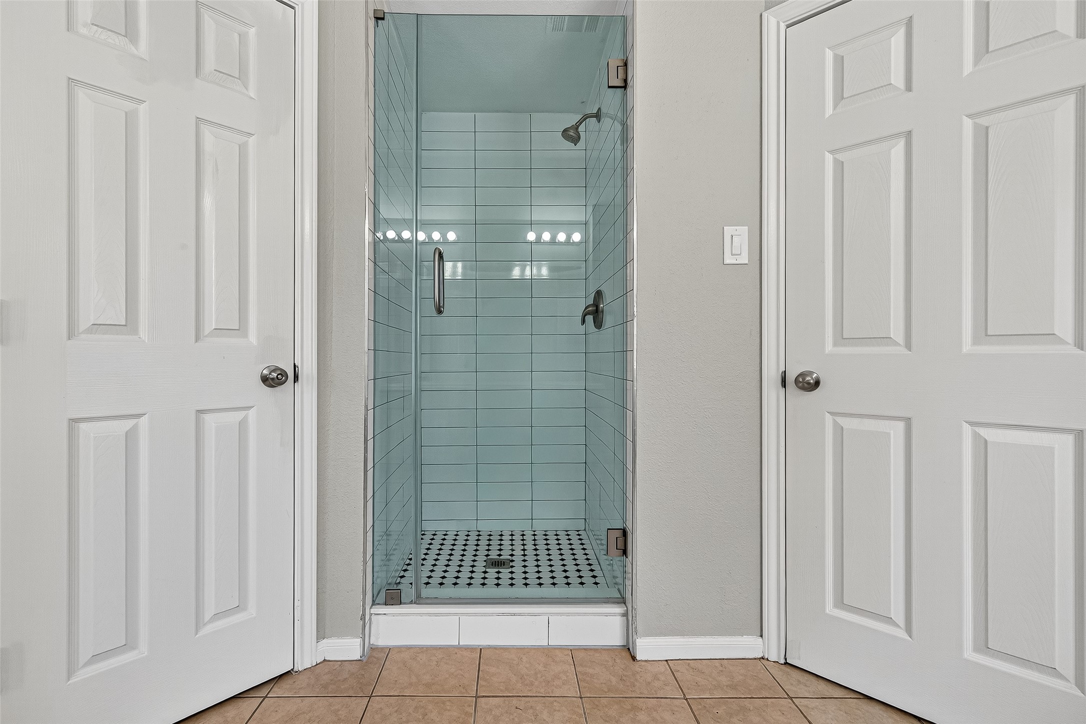 7411 Pacific Ridge Court Houston, TX 77095 - Photo 35 of 50 a bathroom with a glass door shower