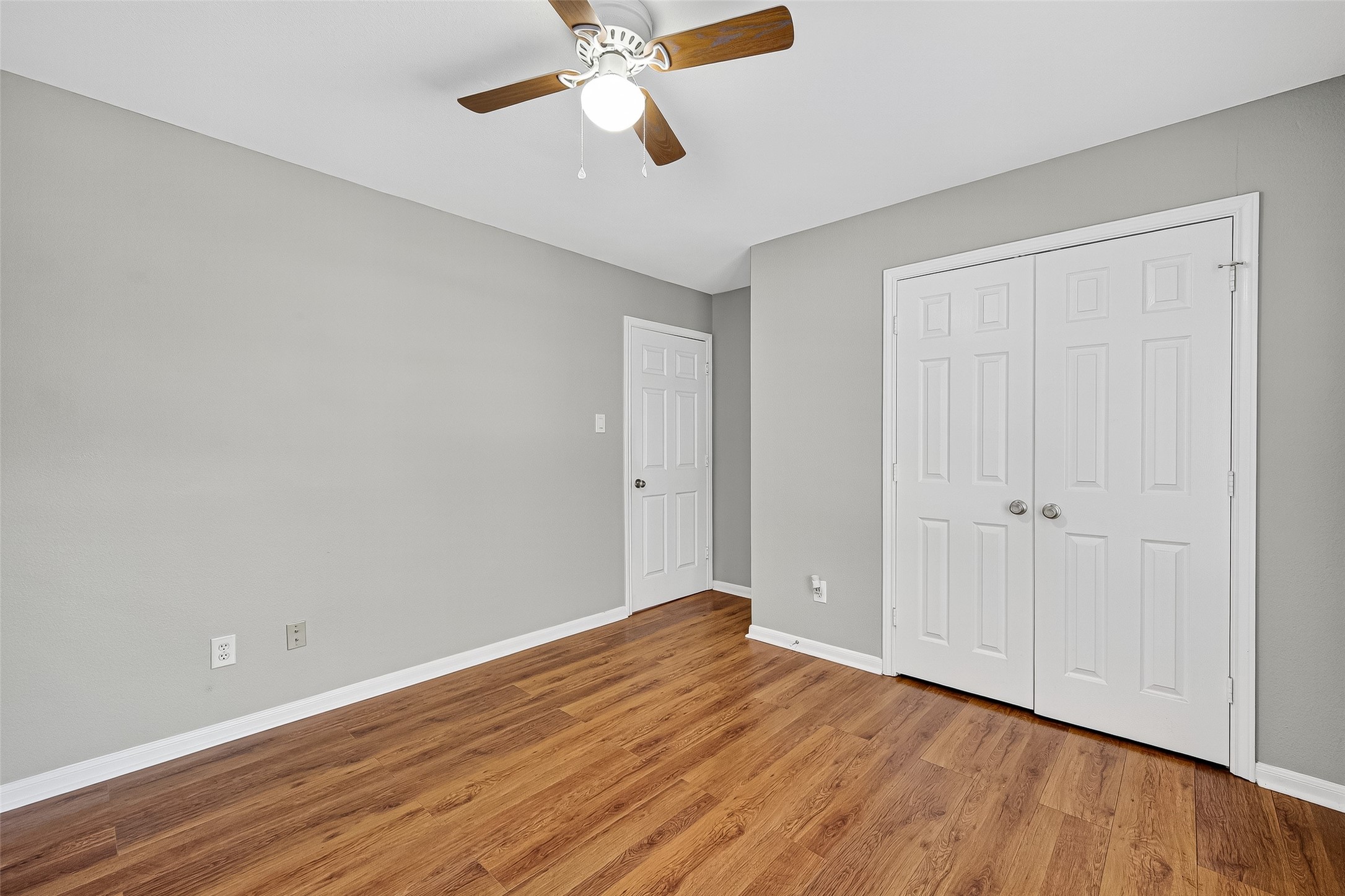 7411 Pacific Ridge Court Houston, TX 77095 - Photo 37 of 50 a view of an empty room with wooden floor