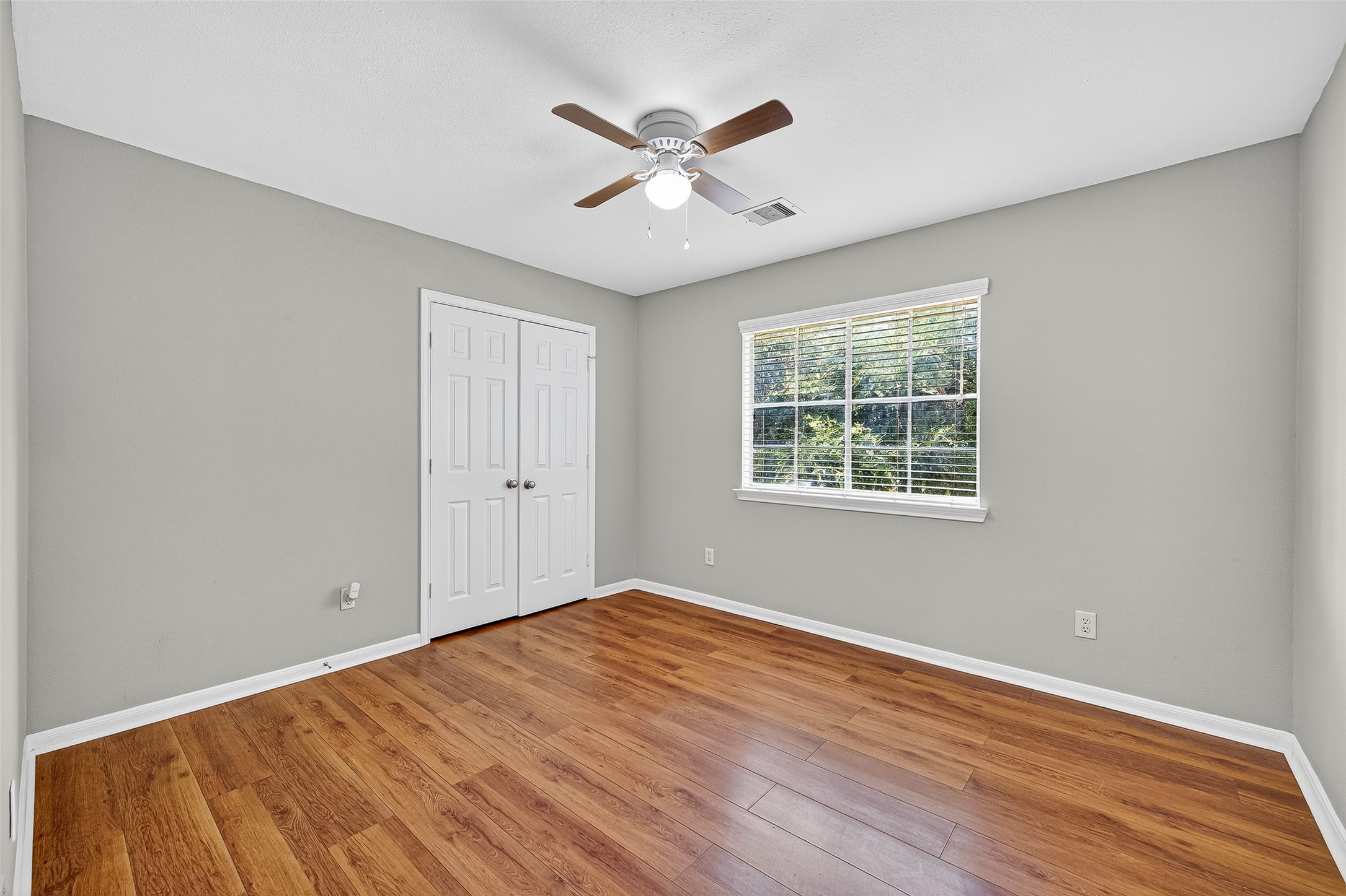 7411 Pacific Ridge Court Houston, TX 77095 - Photo 41 of 50 wooden floor in an empty room with a window