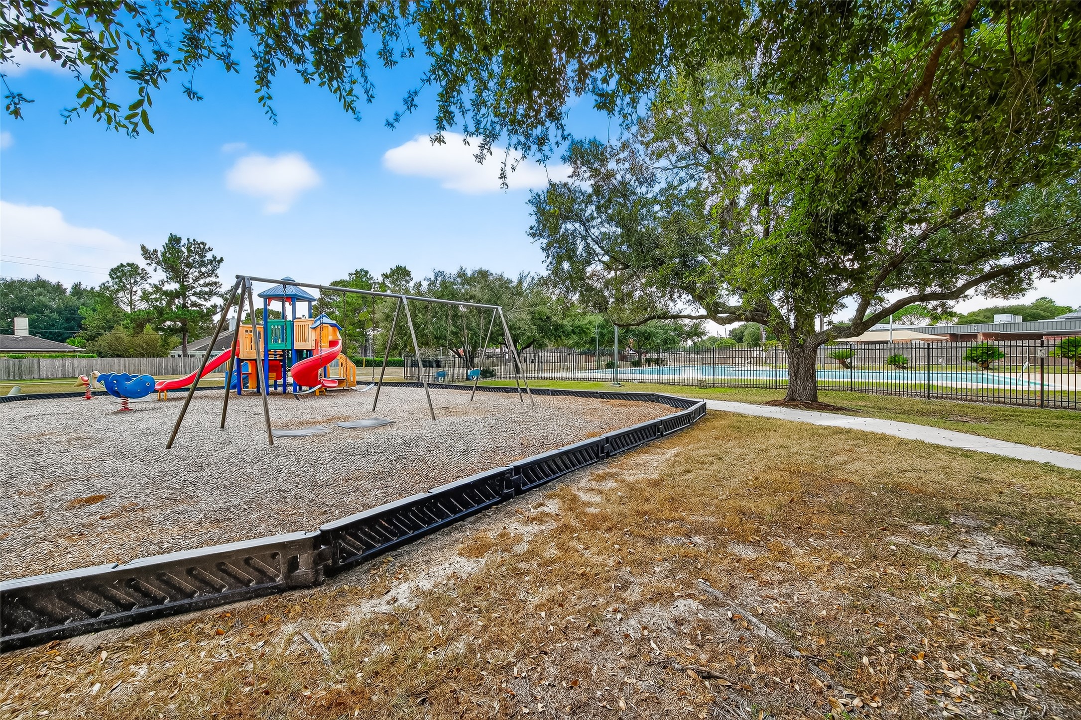 7411 Pacific Ridge Court Houston, TX 77095 - Photo 49 of 50 a view of outdoor space with playground and green space