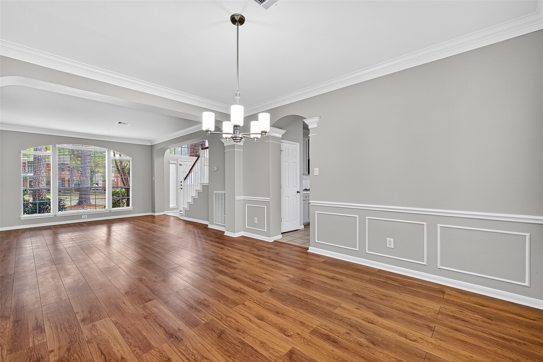 7411 Pacific Ridge Court Houston, TX 77095 - Photo 7 of 50 a view of an empty room with wooden floor and a window