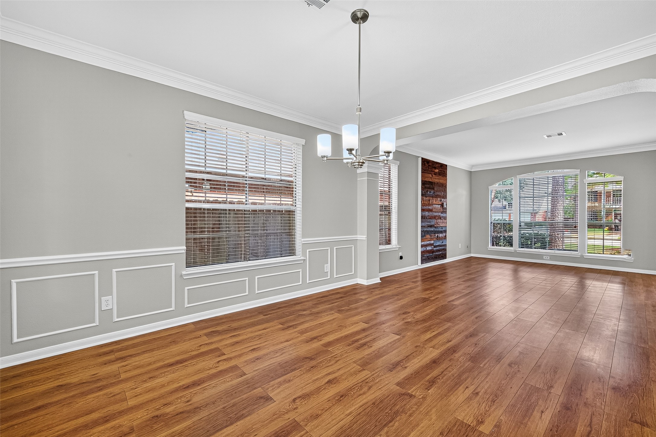 7411 Pacific Ridge Court Houston, TX 77095 - Photo 8 of 50 a view of an empty room with wooden floor and a window
