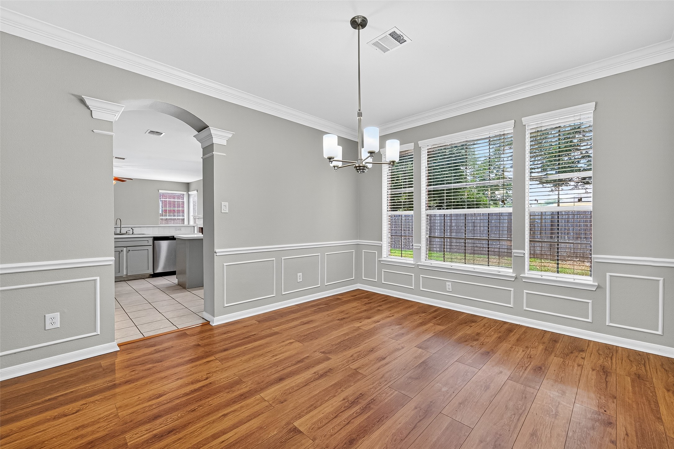 7411 Pacific Ridge Court Houston, TX 77095 - Photo 10 of 50 a view of empty room with wooden floor and fan