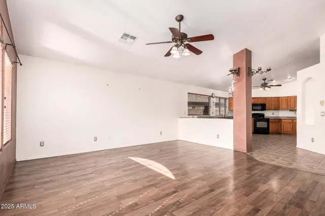 a view of a room with rack and ceiling fan