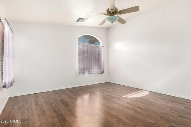 a bathroom with a granite countertop sink a large mirror a shower and a bathtub