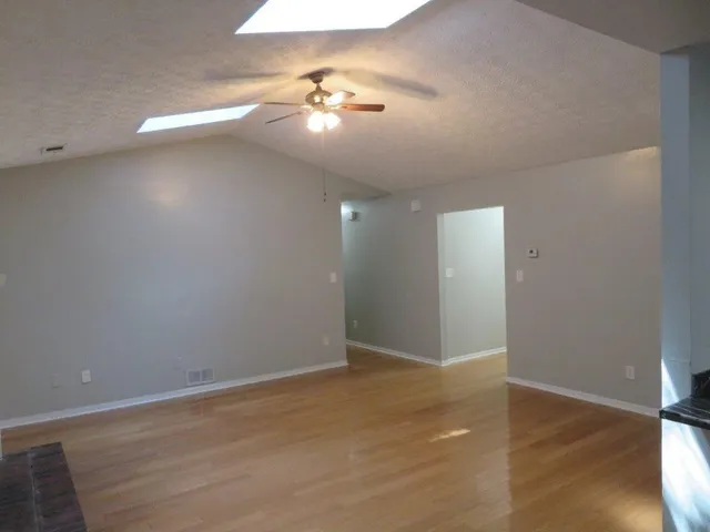 a kitchen with granite countertop stainless steel appliances and wooden cabinets