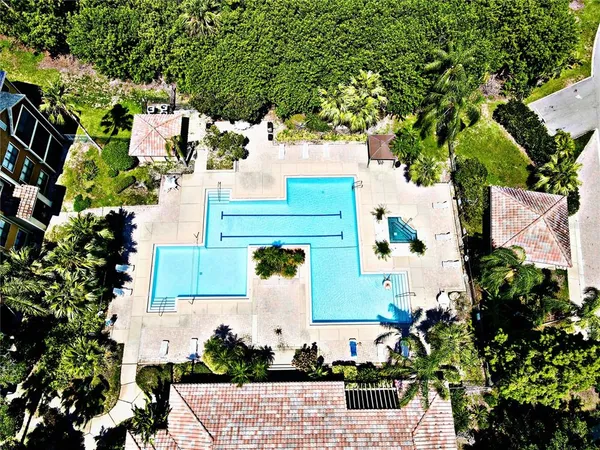 an aerial view of a house with a yard and garden