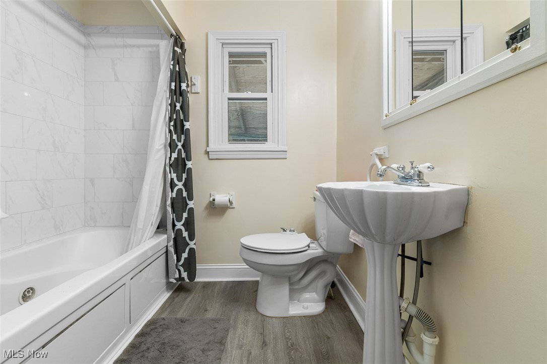 4851 Manchester Road Akron, OH 44319 - Photo 20 of 36 Bathroom featuring wood finished floors and shower / tub combo with curtain