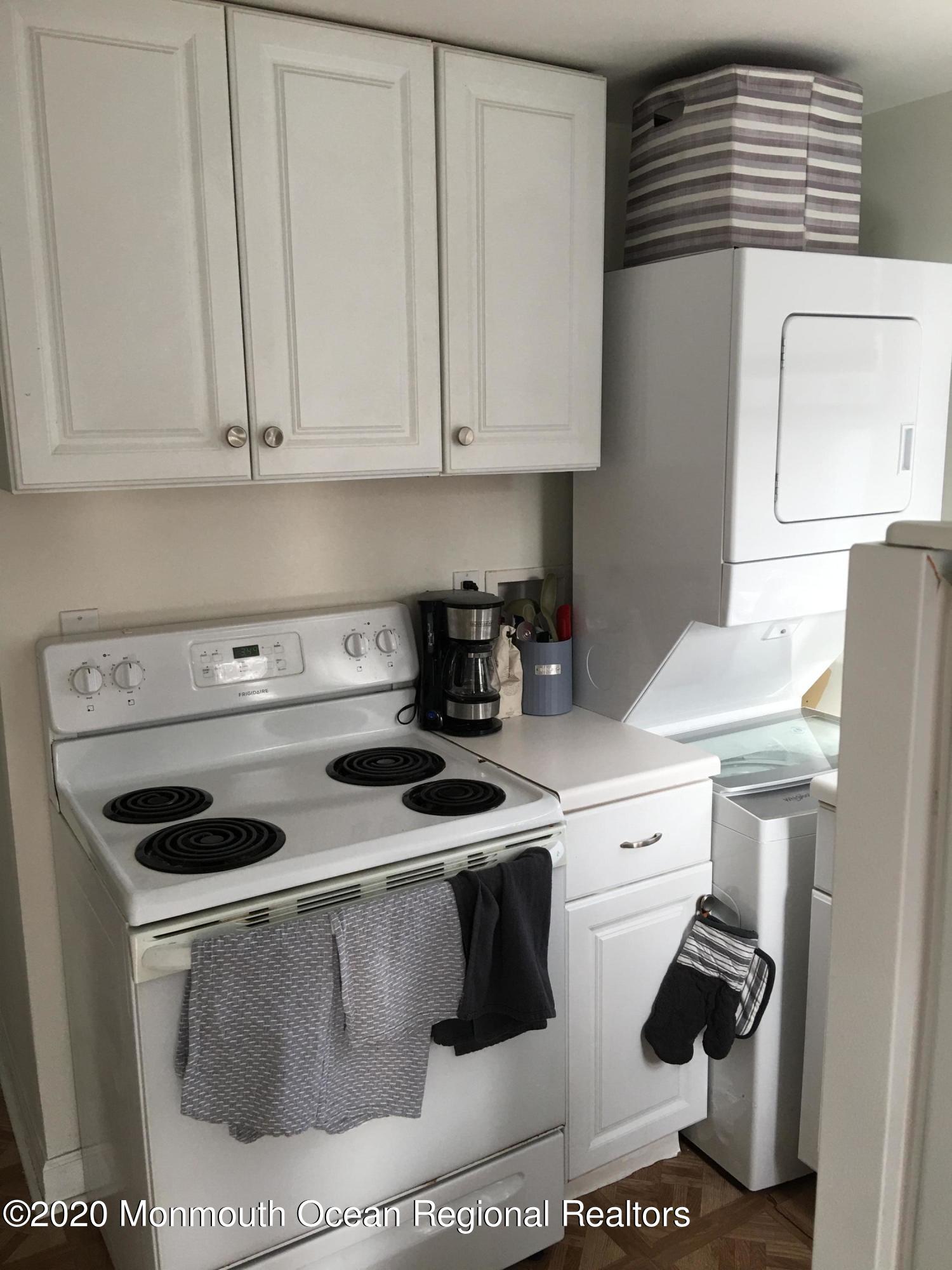 3 Stuyvesant Road Brick, NJ 08723 - Photo 4 of 10 a kitchen with a stove and white cabinets