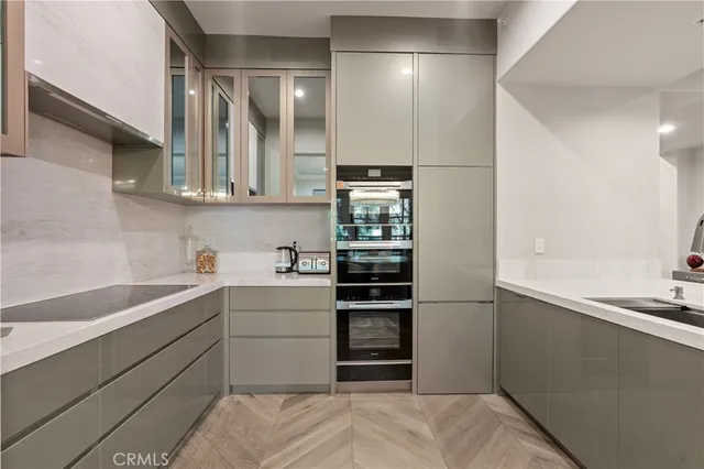 a kitchen with a sink and cabinets