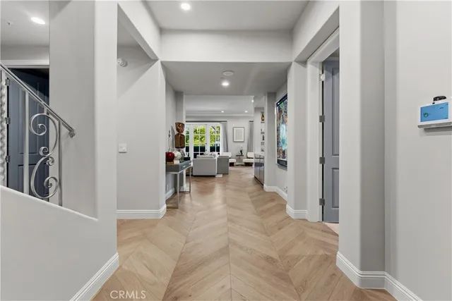 a view of a hallway with furniture and a livingroom view