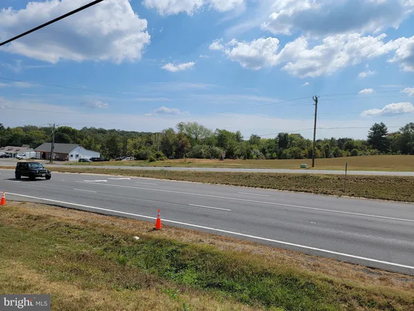 a view of a road with a yard