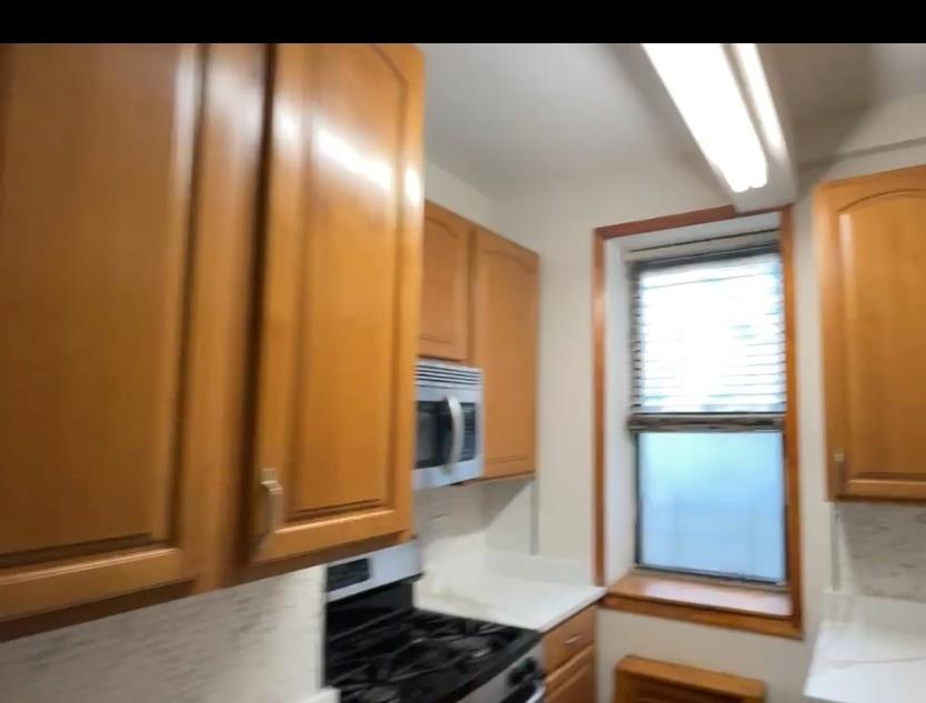 1237 Avenue Z, Unit NN Brooklyn, NY 11235 - Photo 9 of 12 a view of a hallway with wooden floor
