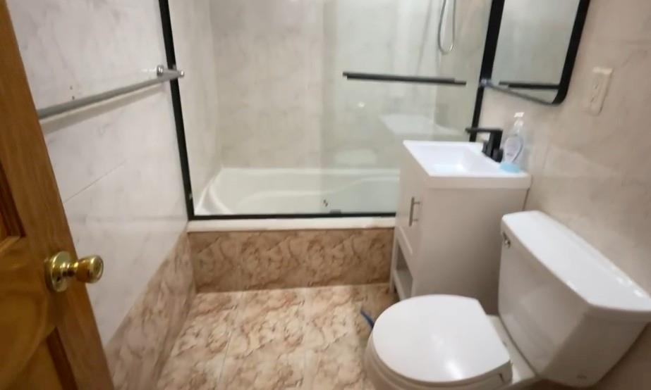 1237 Avenue Z, Unit NN Brooklyn, NY 11235 - Photo 10 of 12 a bathroom with a toilet and a shower