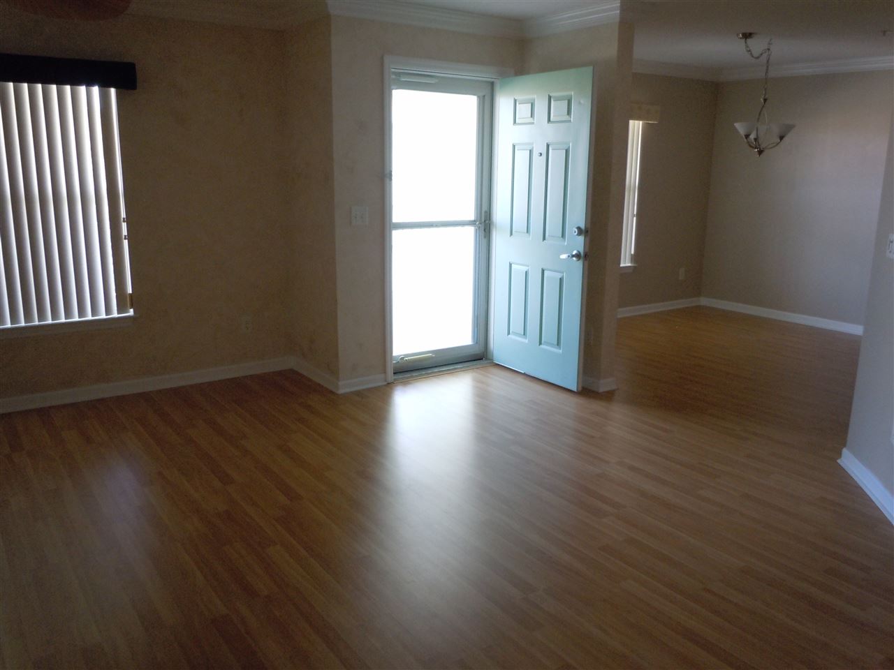 204 J 16th Street St. Augustine Beach, FL 32080 - Photo 18 of 21 an empty room with wooden floor and windows