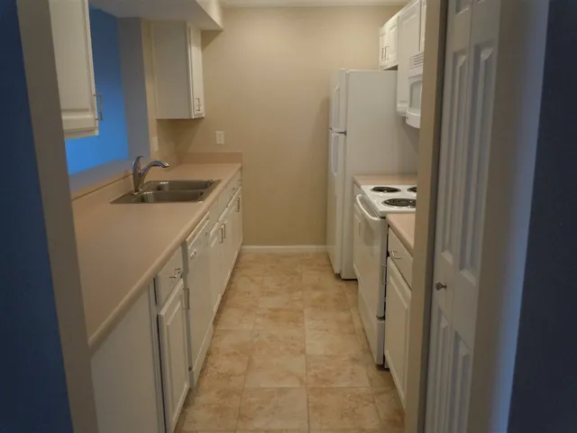 a bathroom with a sink a mirror and a shower