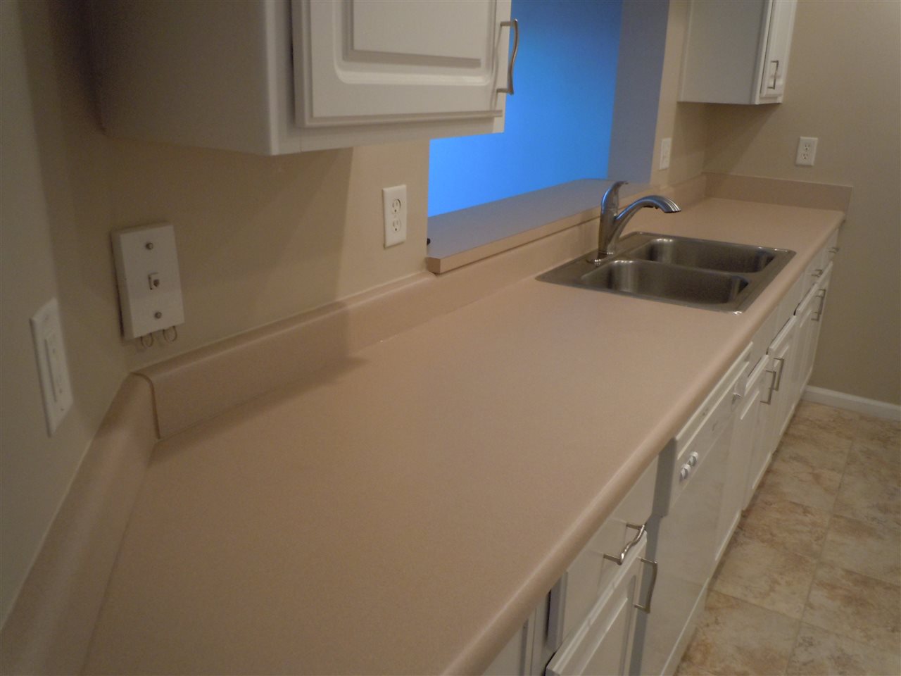 204 J 16th Street St. Augustine Beach, FL 32080 - Photo 9 of 21 a kitchen with a sink and cabinets