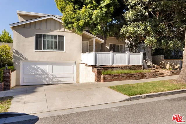 a house view with a outdoor space