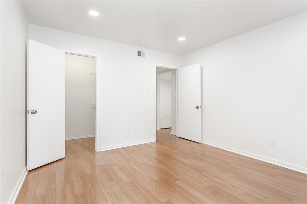 6061 Milton Street, Unit 231 Dallas, TX 75206 - Photo 17 of 27 Spacious secondary bedroom with clean modern finishes and excellent flexibility for guests, remote work, or additional living needs.