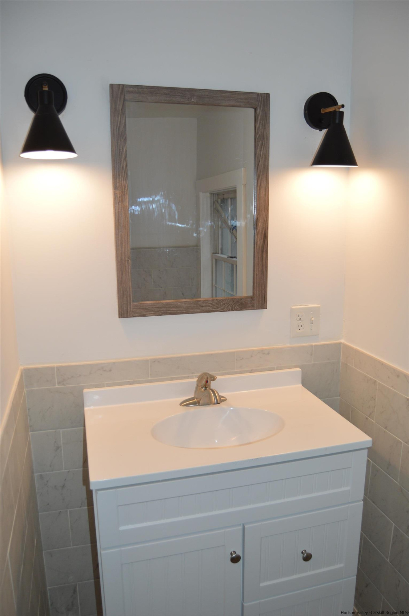 128 Cole Bank Road Saugerties, NY 12477 - Photo 12 of 26 a bathroom with a sink and a mirror