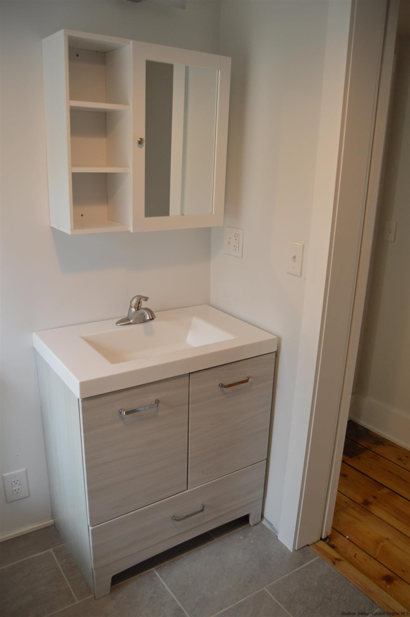 128 Cole Bank Road Saugerties, NY 12477 - Photo 19 of 26 a bathroom with a sink and a mirror